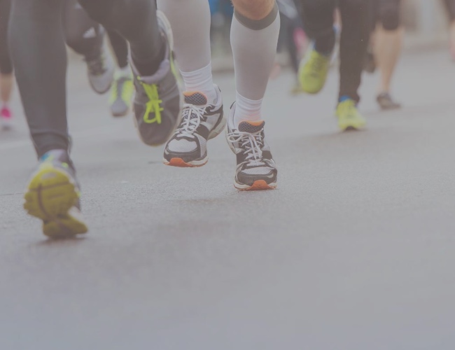 Running shoes on pavement